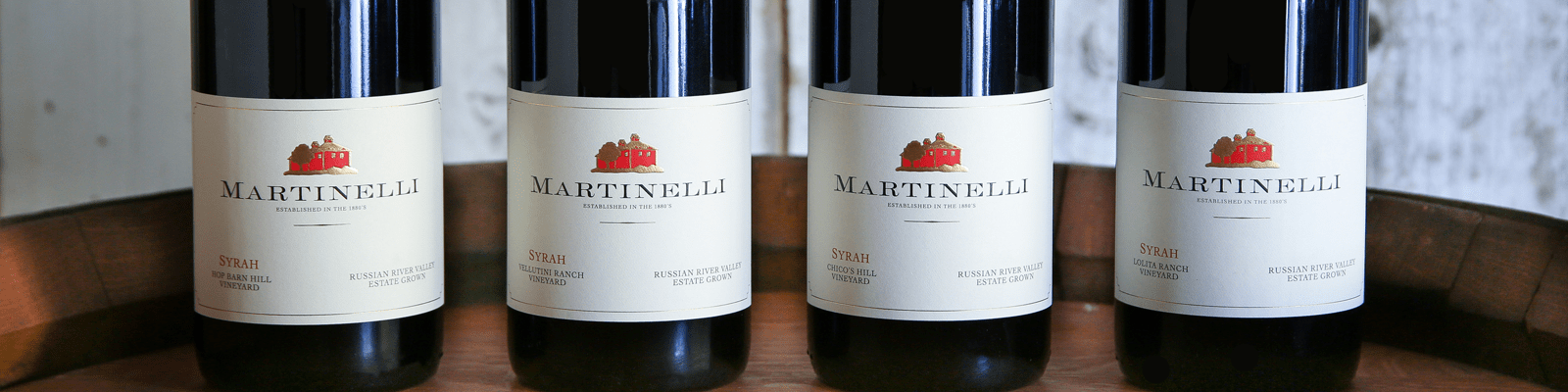 Four Martinelli Syrah wine bottles