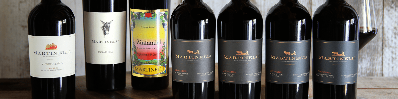 Seven Martinelli different red wine bottles